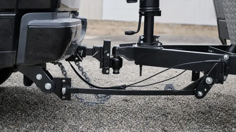 A weight distribution hitch with spring bars and chains